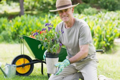 Preparing soil and planting in a residential garden in Kenton